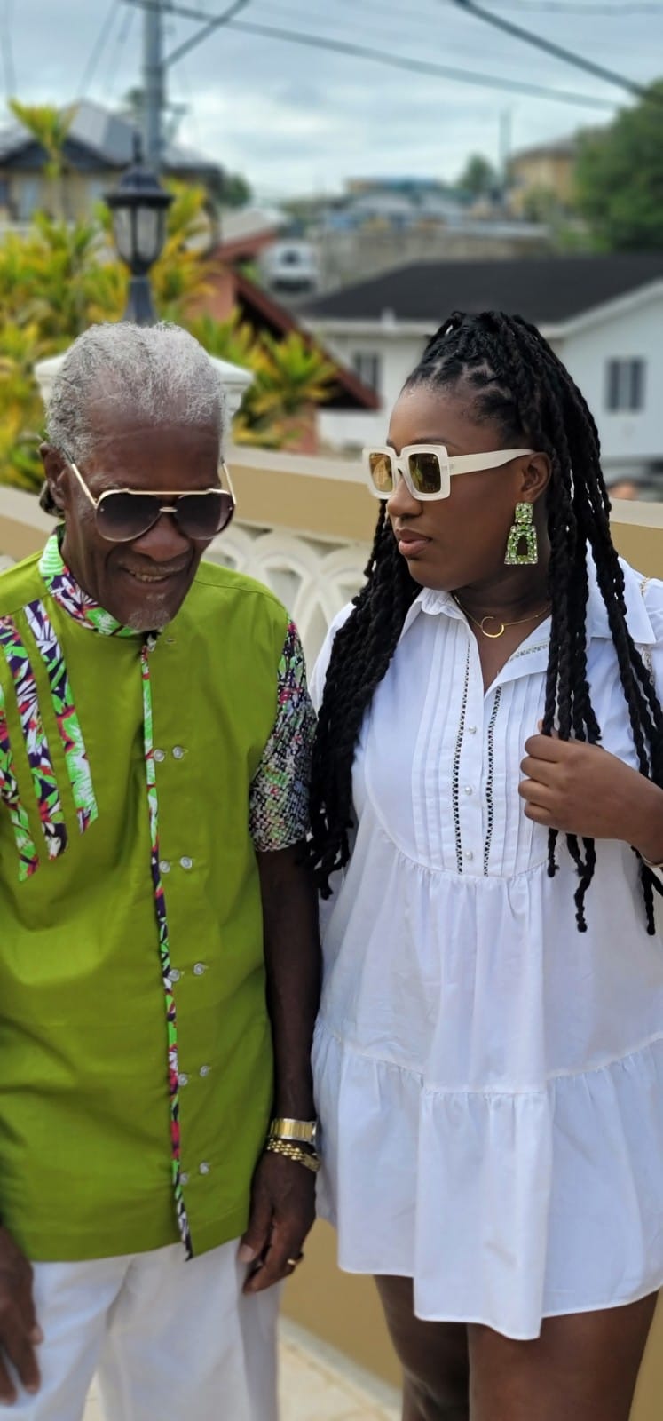 Cristall pictured with her father in Trinidad. 